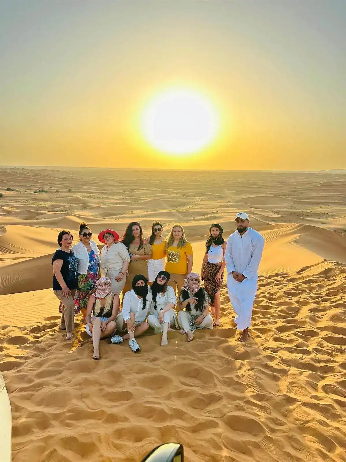Sunset desert group photo in Dubai